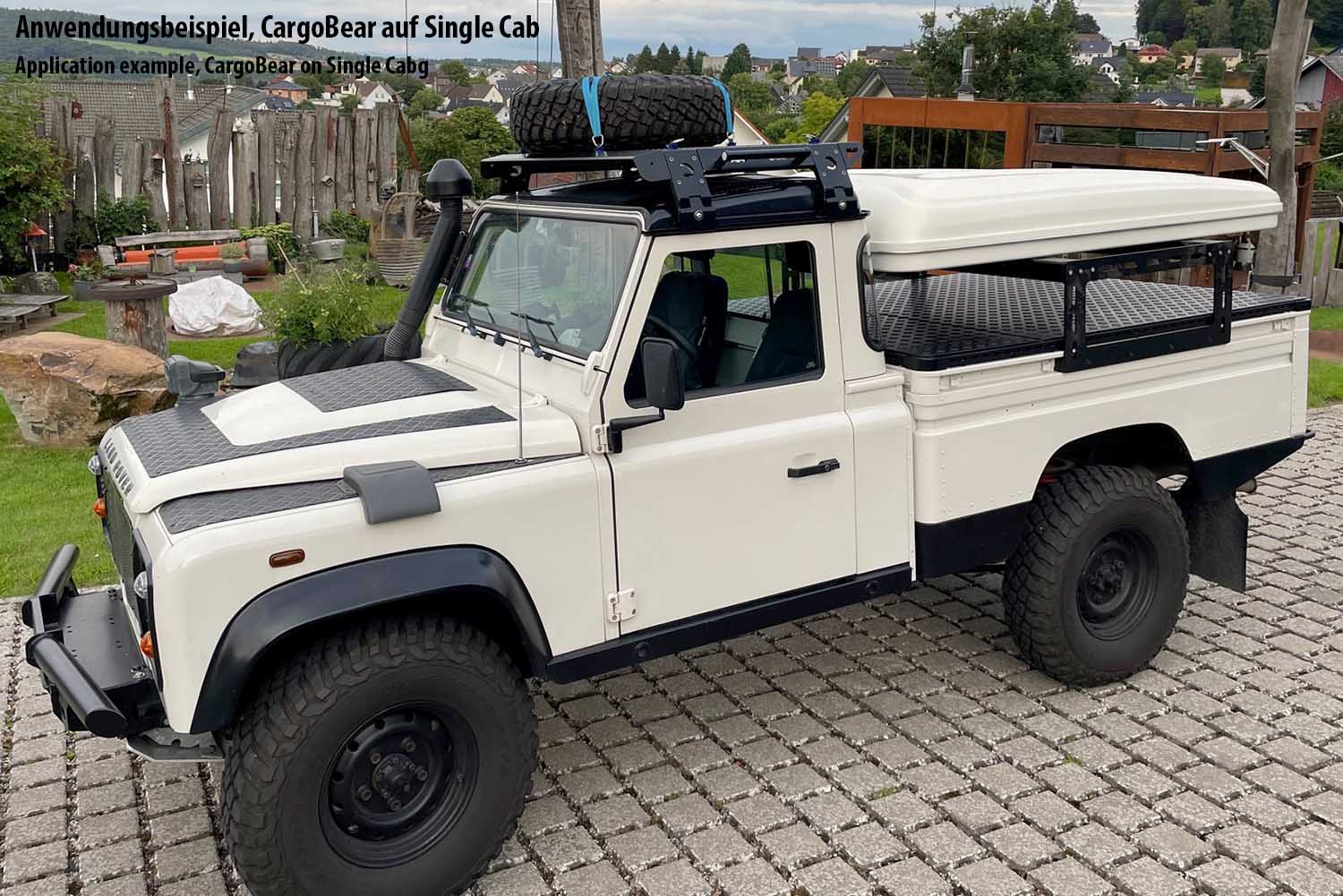 Defender Single Cab, mit kurzer Erweiterung, Querbügel, Windschott und Abschlussträger